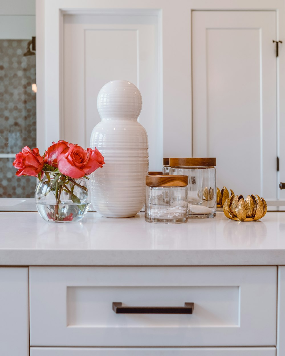 clear glass jars on white wooden table