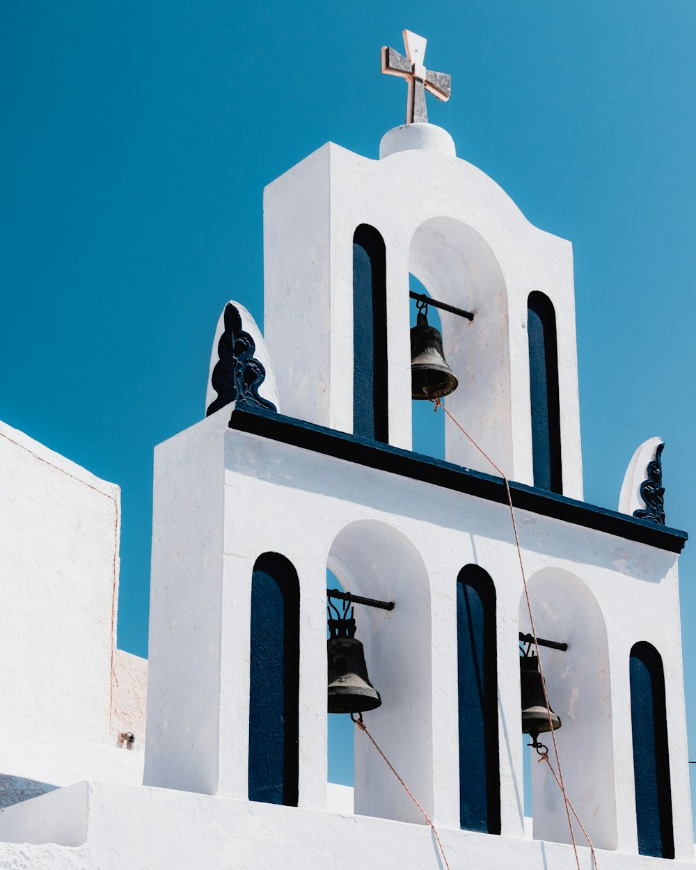 black bell on top of building