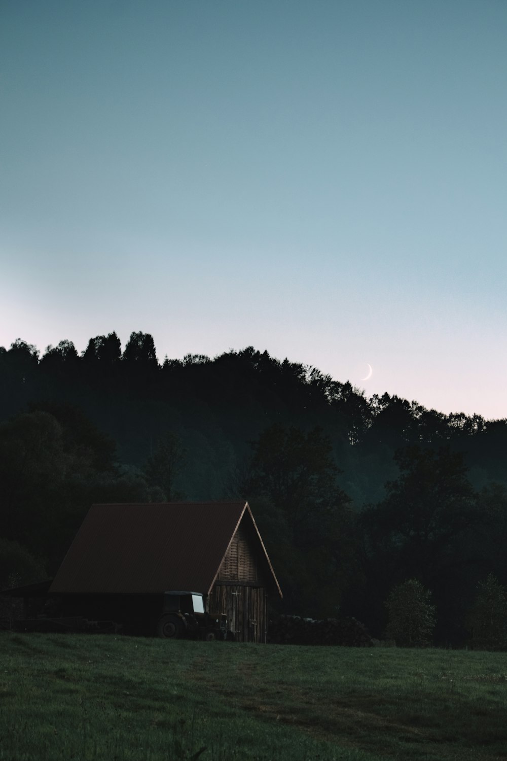 brown wooden house on top of hill