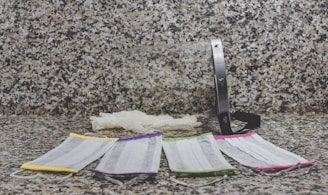 purple and white textile on brown and black marble table