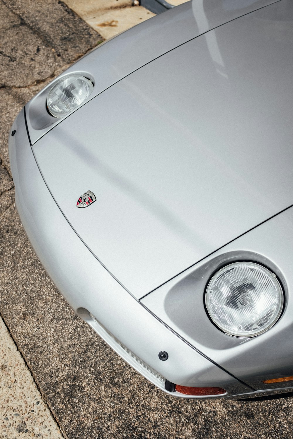 white car on brown concrete floor