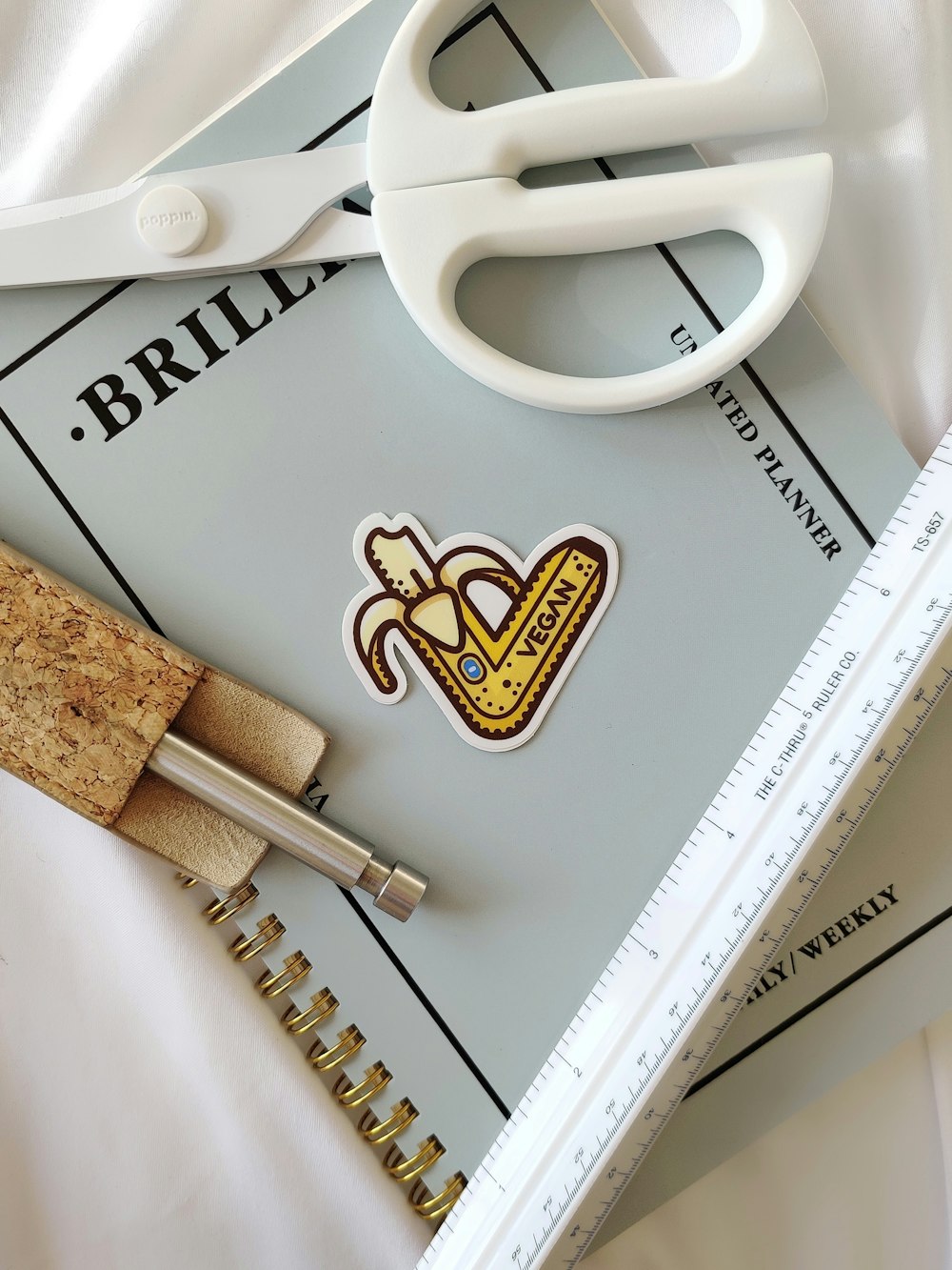 a pair of scissors sitting on top of a book