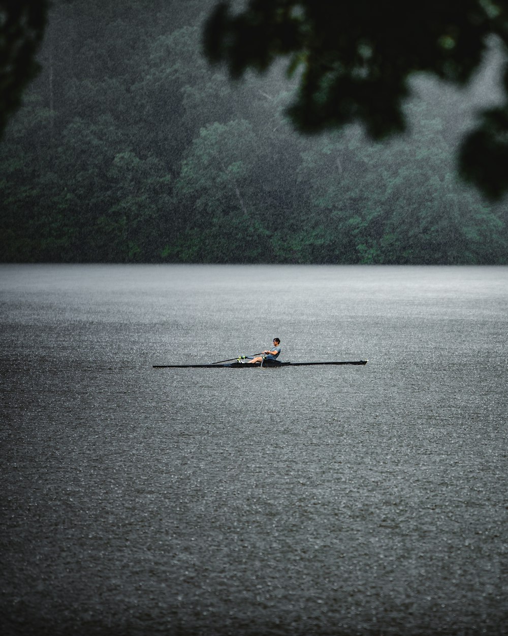 person riding on boat on body of water during daytime