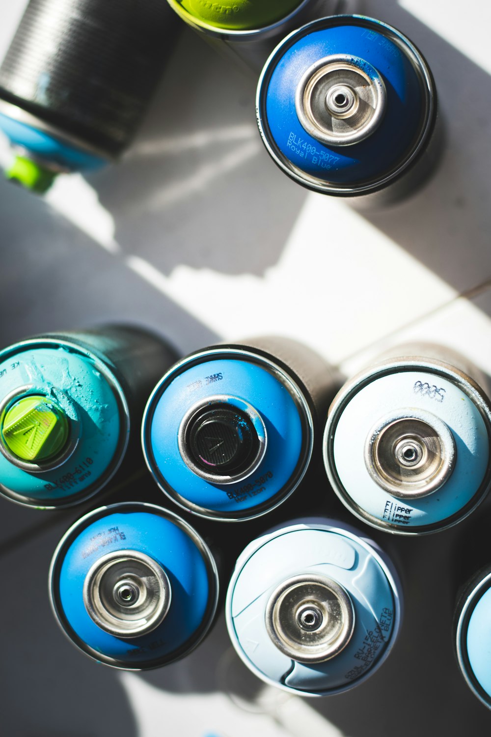 blue and silver can on white table