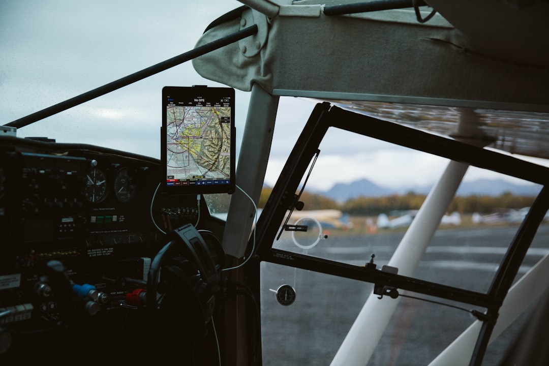 black and gray steering wheel, Plane sits on tarmac