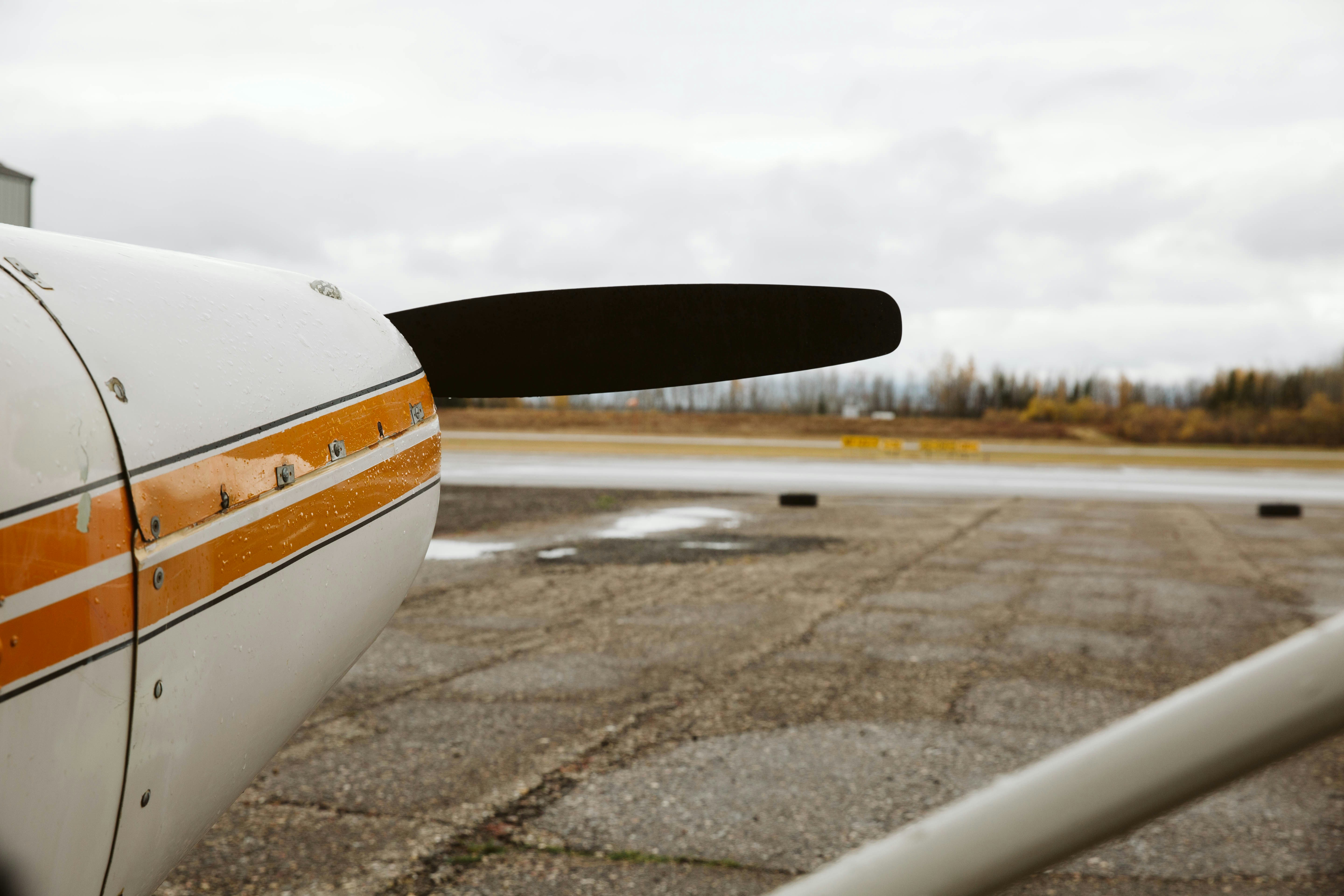 white and black airplane on gray asphalt road during daytime, Airplane on tarmac