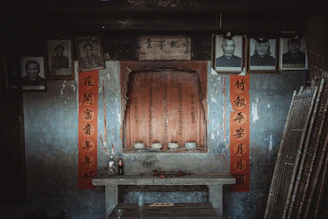 Family members sharing stories around a traditional ancestral altar.