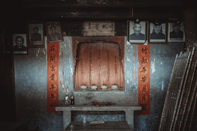 Family members sharing stories around a traditional ancestral altar.