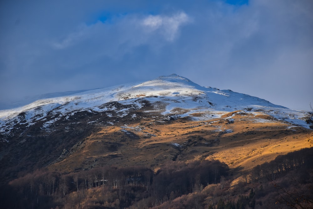 brown and white mountain under blue sky during daytime