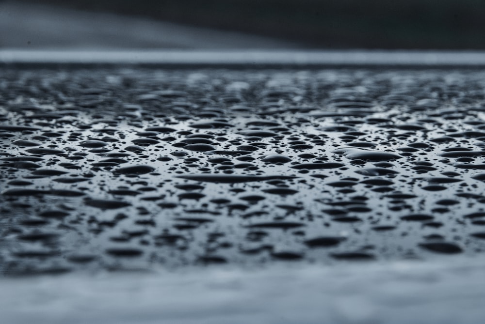 water droplets on gray concrete floor