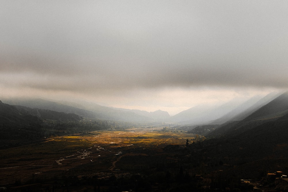 green mountains under white clouds during daytime