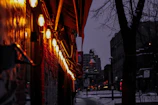 Outdoor lighting setup glowing warmly in the evening at a local business near 444 W Portland Ave.