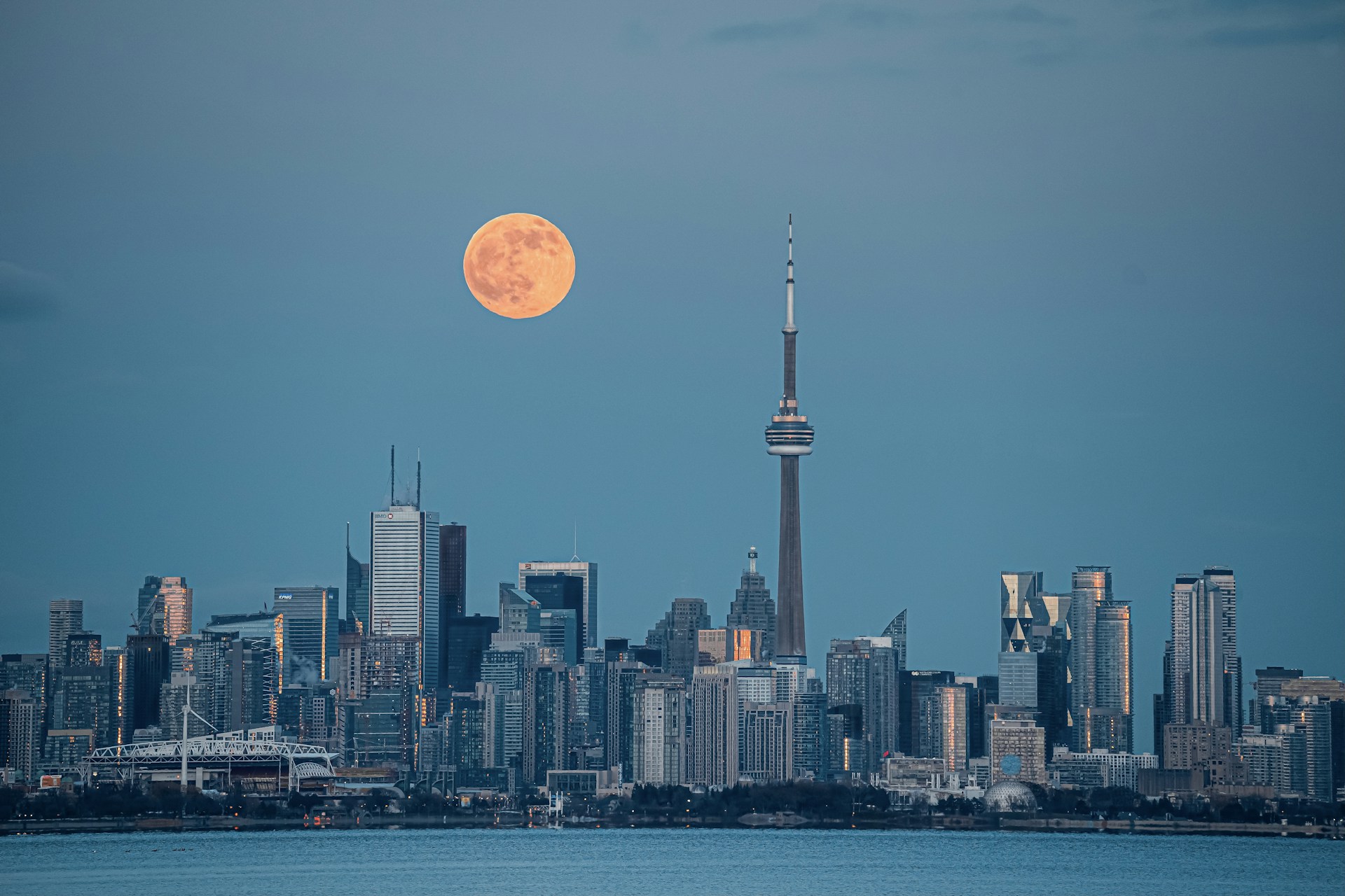 city skyline under full moon