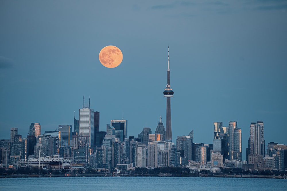 city skyline under full moon