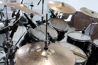 A vibrant drum kit set up with colorful sticks ready for a recording session.