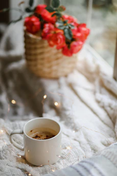 A cozy scene with a soft throw blanket and a cup of coffee, representing lifestyle comfort products.