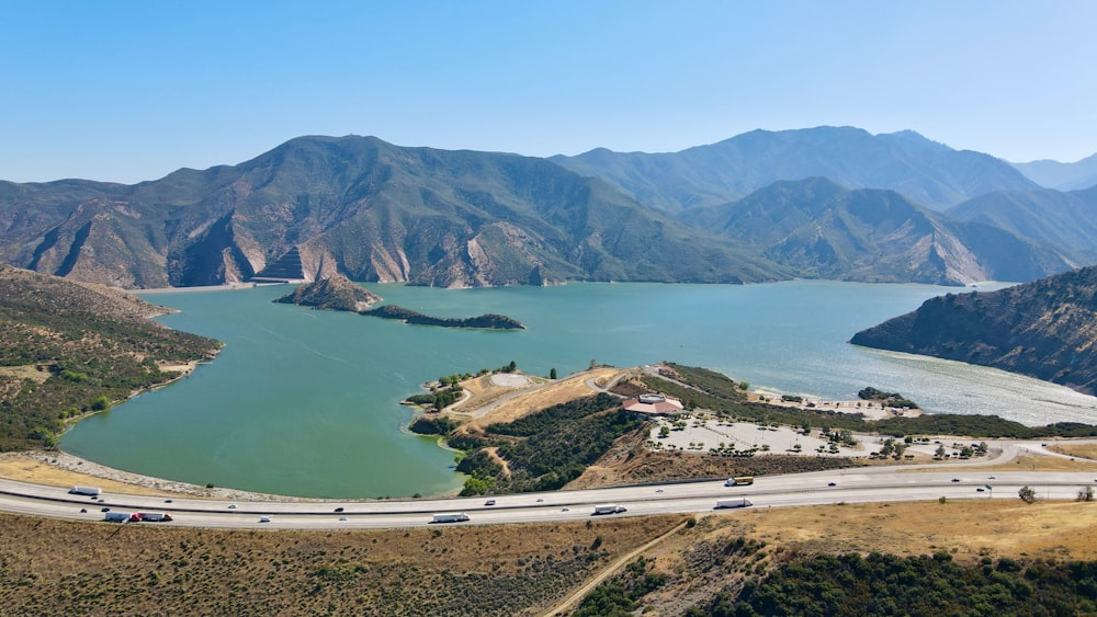 aerial view of green mountains and body of water during daytime