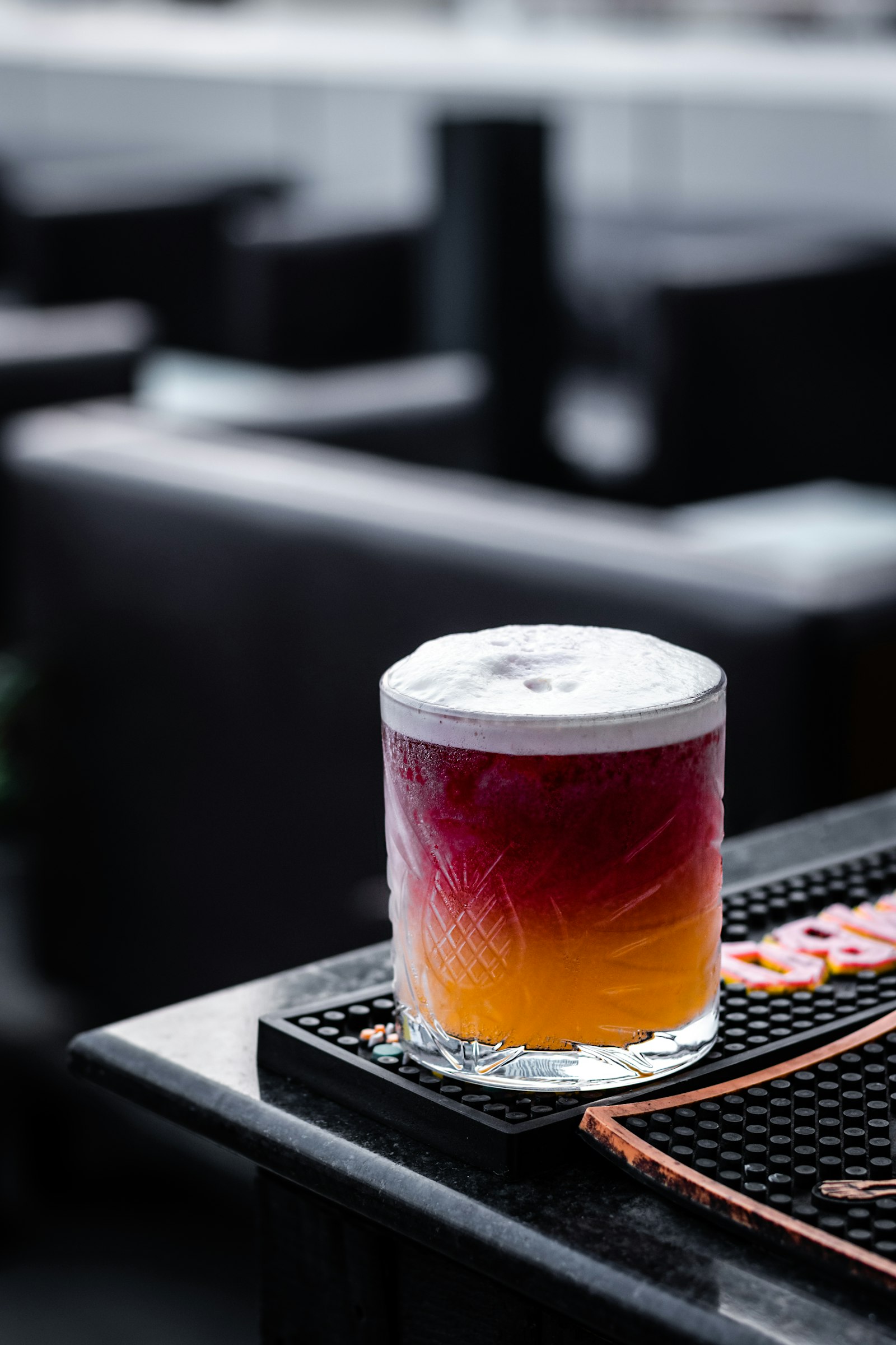 Moody alcohol-free cocktail presentation with dark ambiance