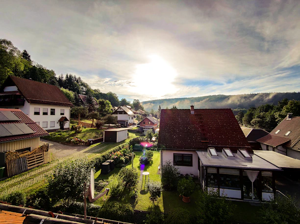 A welcoming neighborhood with modern homes bathed in warm sunlight.