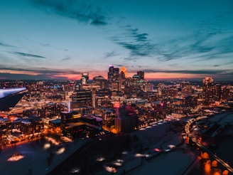 city with high rise buildings during night time