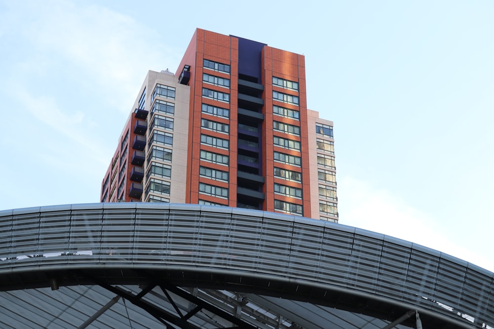 brown and white concrete building under blue sky during daytime