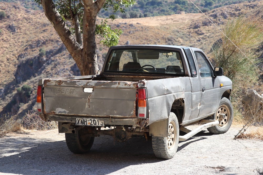 white and brown single cab pickup truck