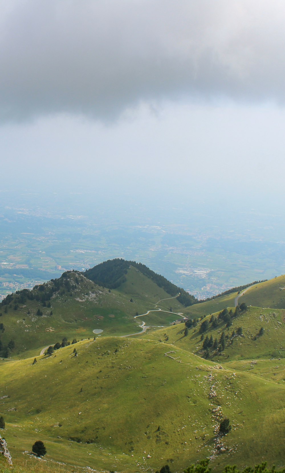 green mountains under white clouds during daytime