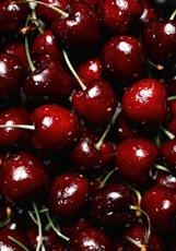 red cherry fruit in close up photography