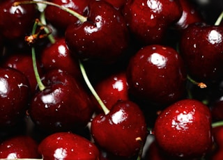 red cherry fruit in close up photography