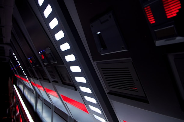 Futuristic high-tech cleaning team working in an industrial corporate environment with blue gradient lighting.