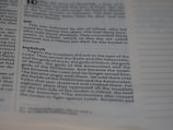 A close-up view of a page from a religious text, with a focus on a passage about Jephthah. The text discusses the Israelites turning to other gods, provoking the anger of the Lord. The font is clear and the surrounding lines provide a structured appearance.