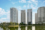 body of water near trees and high rise buildings during daytime
