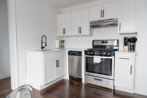 A kitchen corner with stainless steel appliances and elegant cabinetry, blending function and design.
