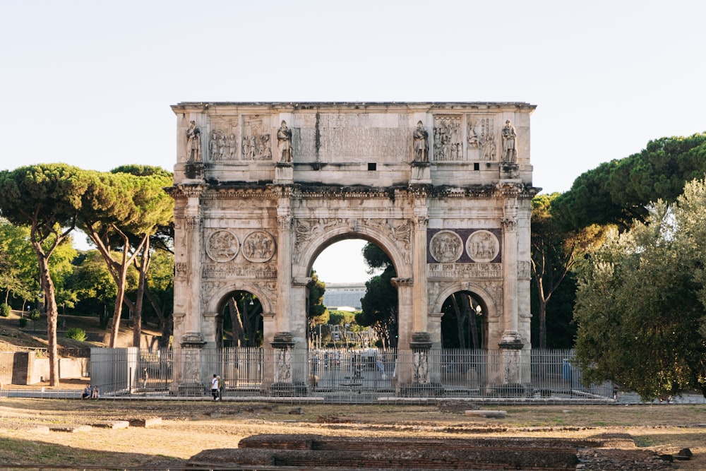 people walking on gray concrete arch during daytime