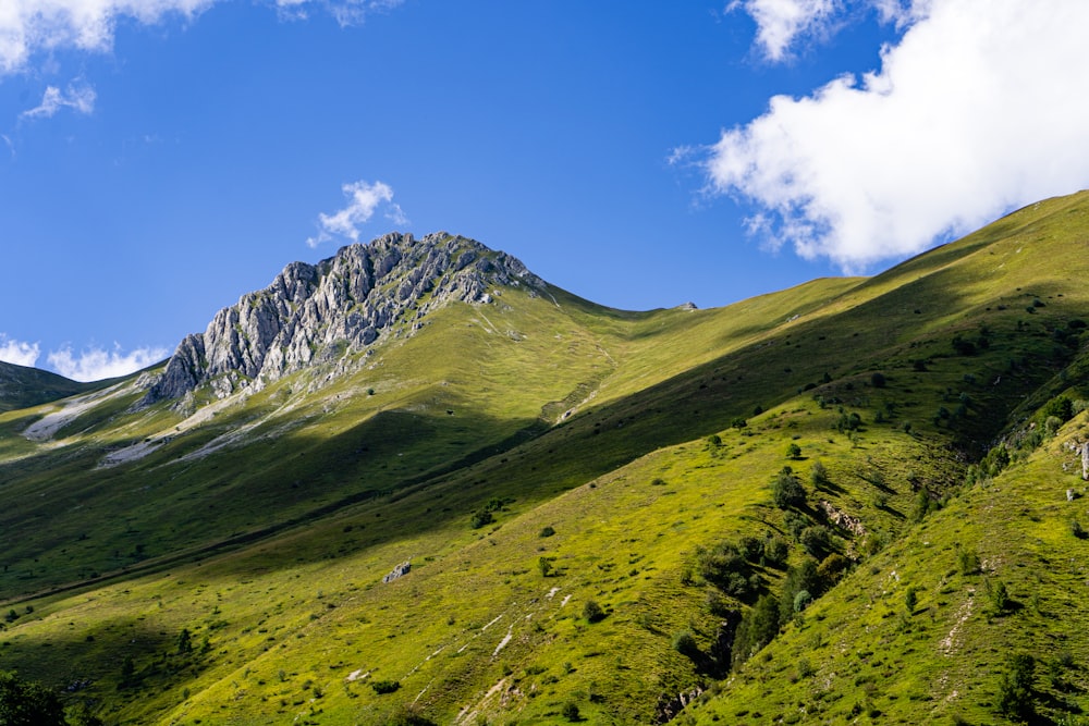 green and white mountain under blue sky during daytime