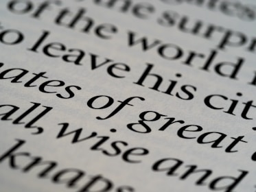 Close-up of elegant serif typography on deep navy background reflecting professionalism.