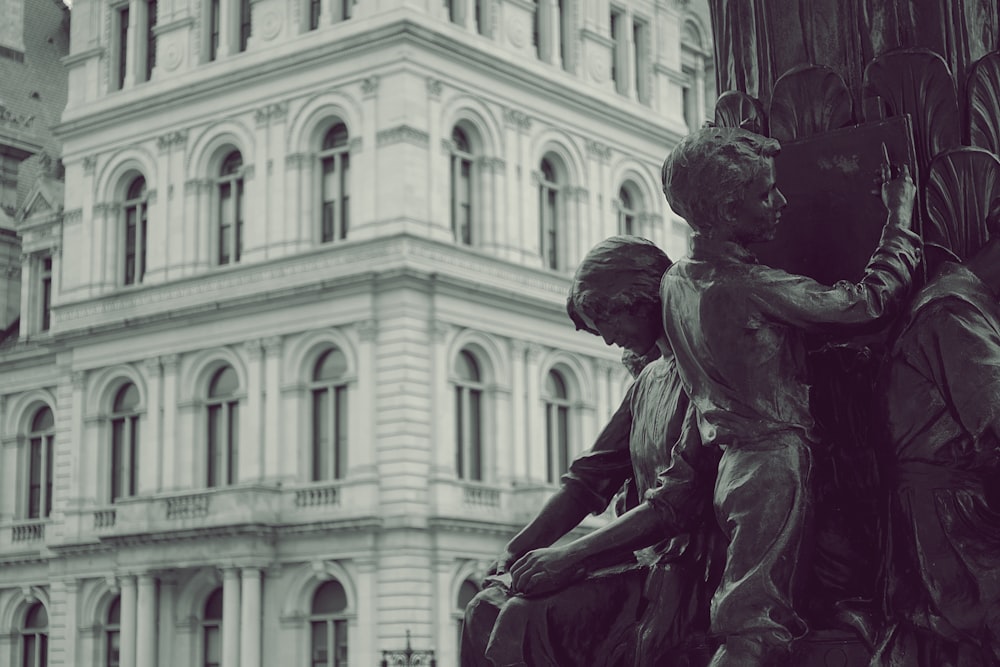 man and woman kissing statue