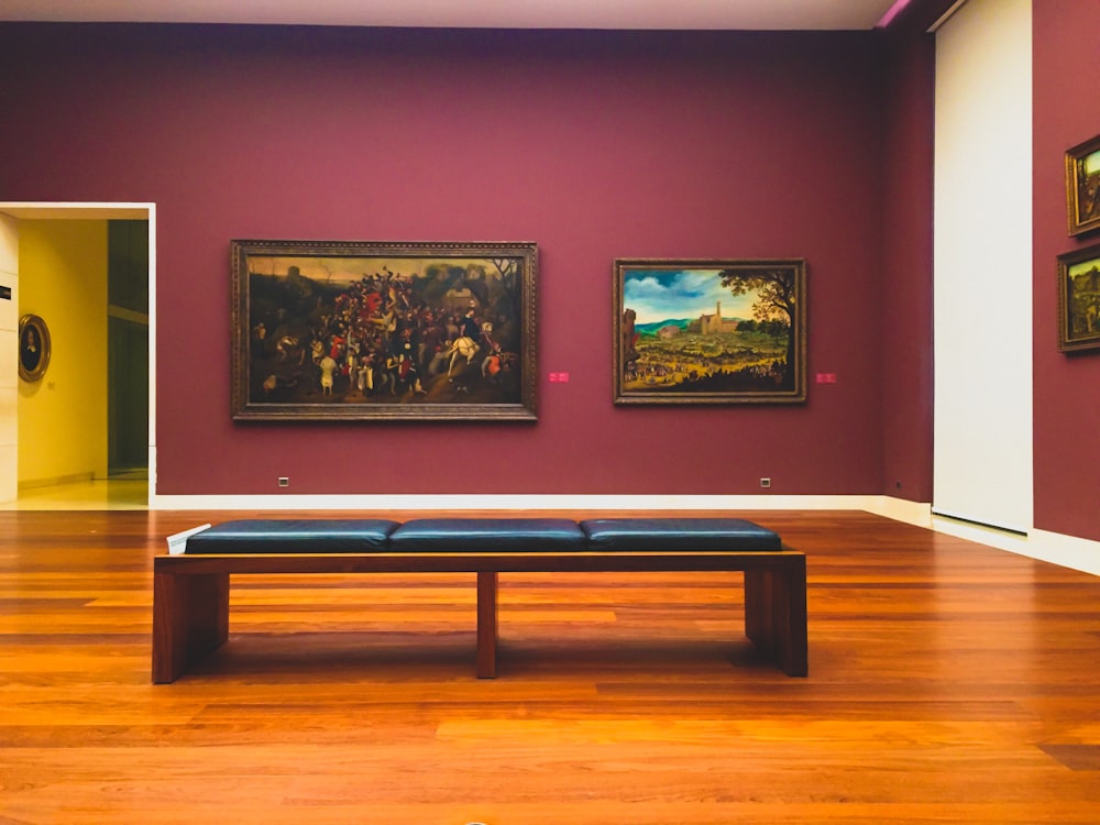 brown wooden billiard table near green trees painting