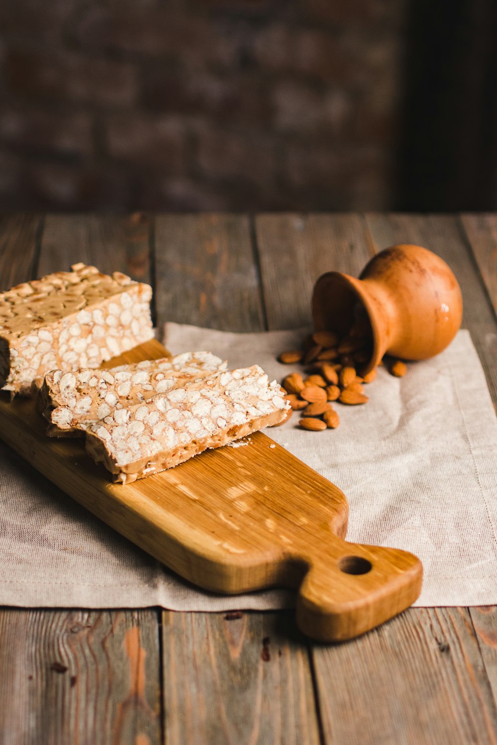 brown wooden rolling pin on brown wooden chopping board