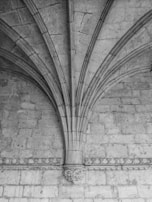 An intricate stone archway from an ancient cathedral.