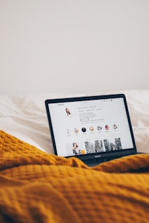 black tablet computer on white textile