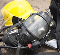 black gas mask on gray concrete floor