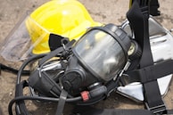A close-up of safety equipment, including helmets and gloves.