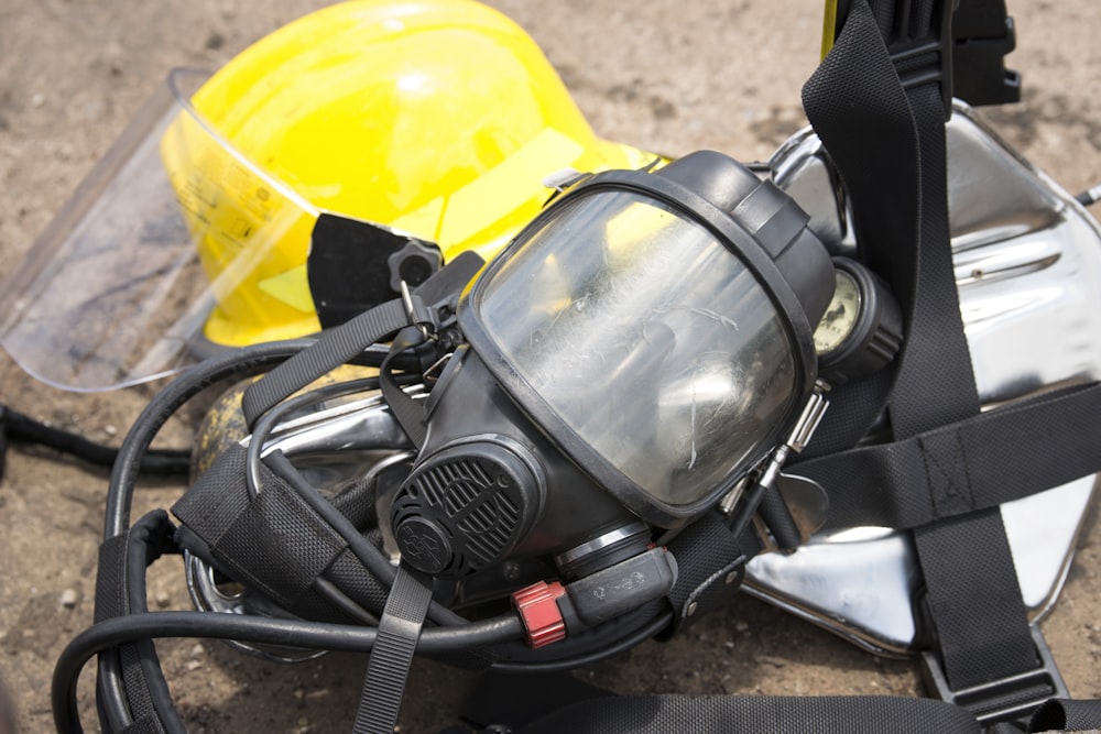 black gas mask on gray concrete floor