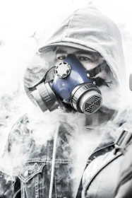 person wearing white gas mask