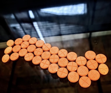 orange round medication pill lot