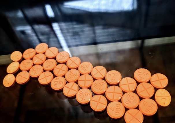 orange round medication pill lot