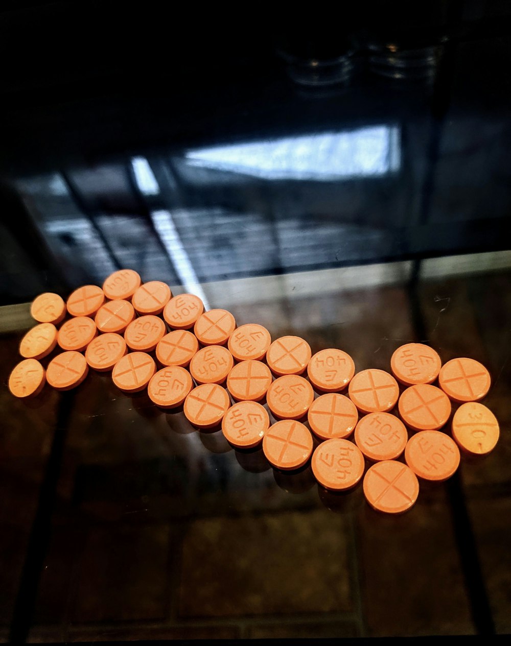 orange round medication pill lot