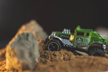Close-up of a detailed RC crawler navigating rocky terrain.