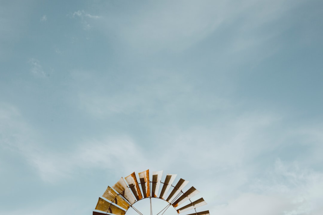 white and brown round building under blue sky during daytime